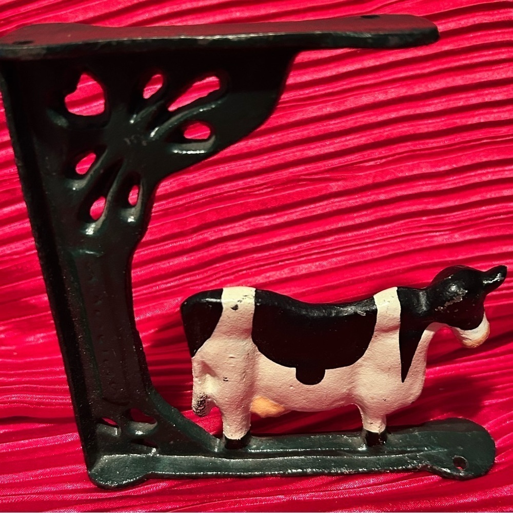 Vintage farmhouse style cow  corner cast iron bracket- collectible decor- used